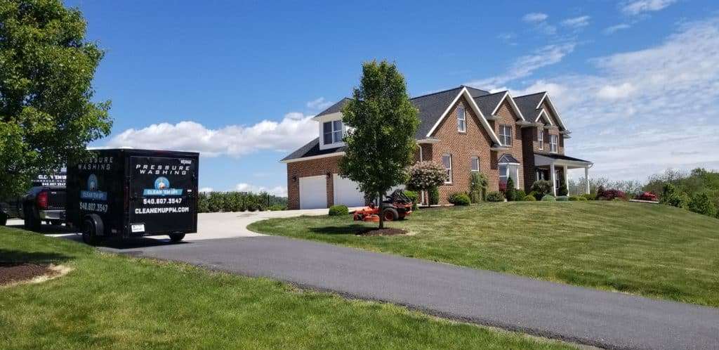 Pressure washing brick house in Staunton